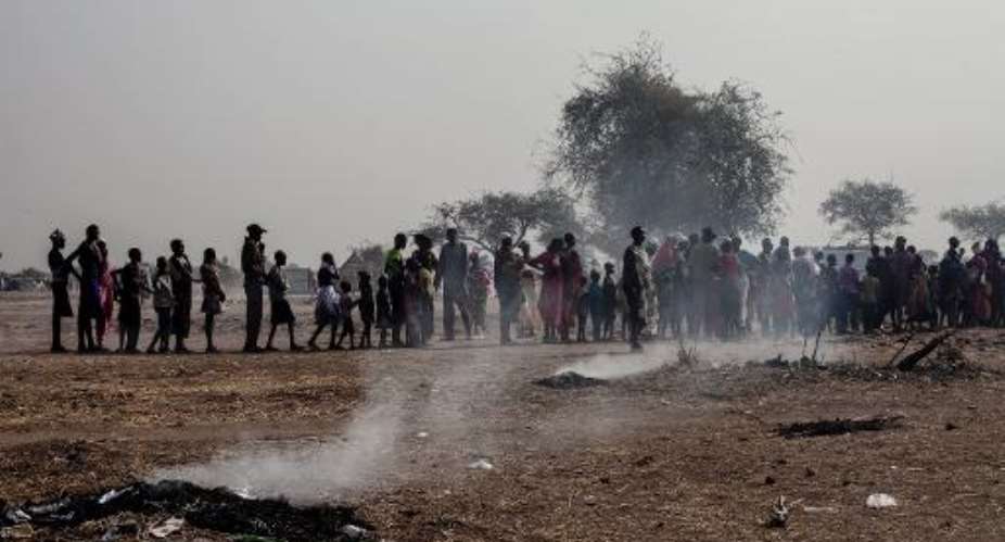 People queue up for registration at the camp for South Sudanese Internally Displaced People in Mingkaman on February 7, 2014.  By Fabio Bucciarelli AFP