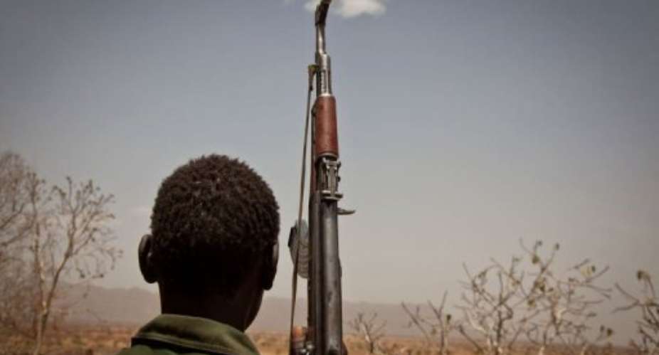A Sudan Peoples Liberation Movement (SPLA-N) rebel looks out toward Talodi, in South Kordofan.  By Adriane Ohanesian (AFP/File)