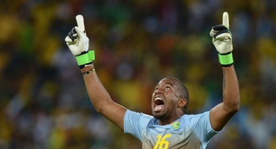 South Africas goalkeeper Itumeleng Khune celebrates his teams opening goal on February 2, 2013, in Durban.  By Francisco Leong (AFP/File)