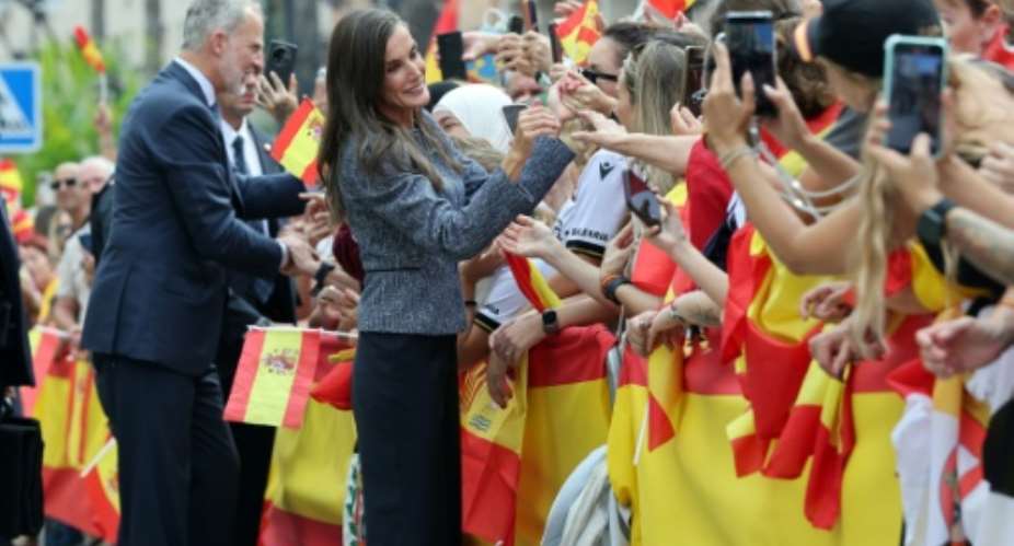 King Felipe VI (L) and Queen Letizia (R) greeted the well-wishers who thronged the streets of Ceuta.  By Thomas COEX (AFP)