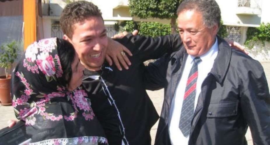 Zakaria Moumni (C) celebrates with his parents.  By Taline Moumni (AFP/HO)