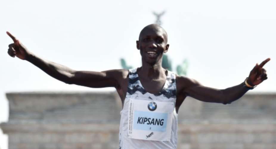 Kipsang, seen here at the Berlin Marathon in 2018, spent the night in jail for breaking Kenya's curfew.  By John MACDOUGALL AFP