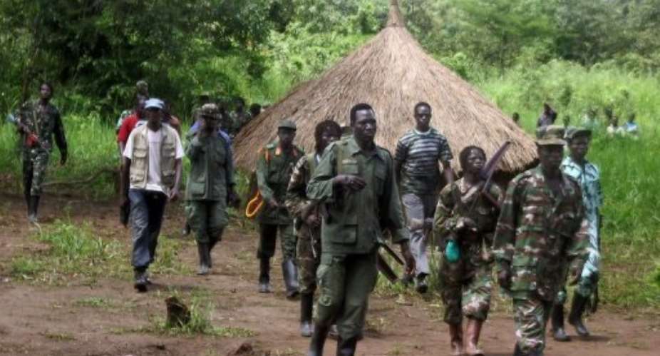 A column of around 40 LRA fighters emerges on September 20, 2006, at Ri-Kwangba on southern Sudans border with DR Congo.  By  (AFP/File)