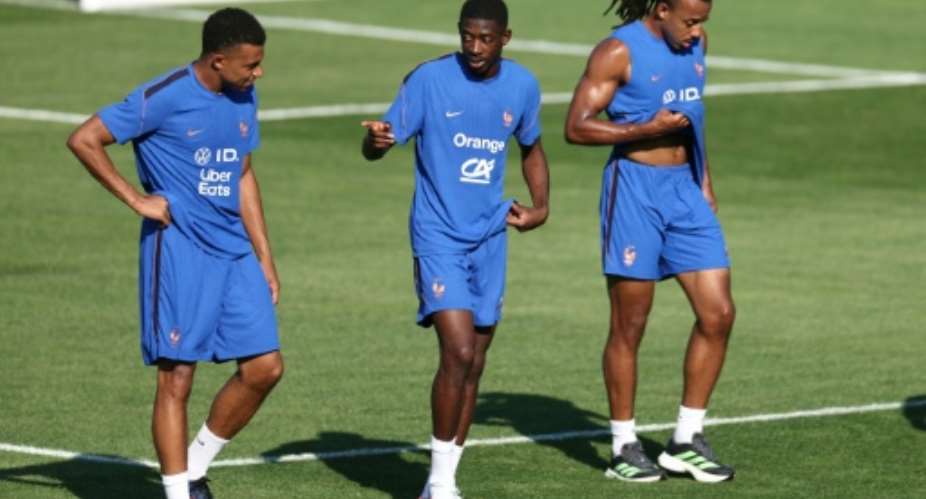 Kylian Mbappe (L) with Ousmane Dembele and Jules Kounde at a France training session on Wednesday in Boston.  By FRANCK FIFE (AFP)