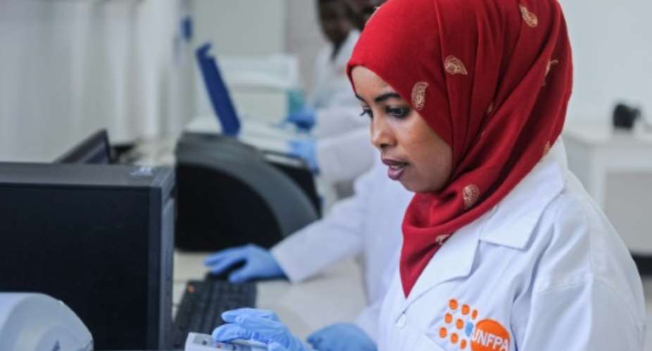 Lab technician Fadumo Jama Yousuf at the Puntland Forensic Center -- a new weapon against Somalia's rape epidemic.  By Mohamed ABDIWAHAB AFP