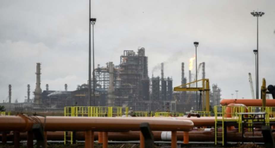 Lagos-based Dangote Petroleum Refinery aims to raise funds to double its capacity to 1.4 million barrels a day.  By TOYIN ADEDOKUN (AFP/File)