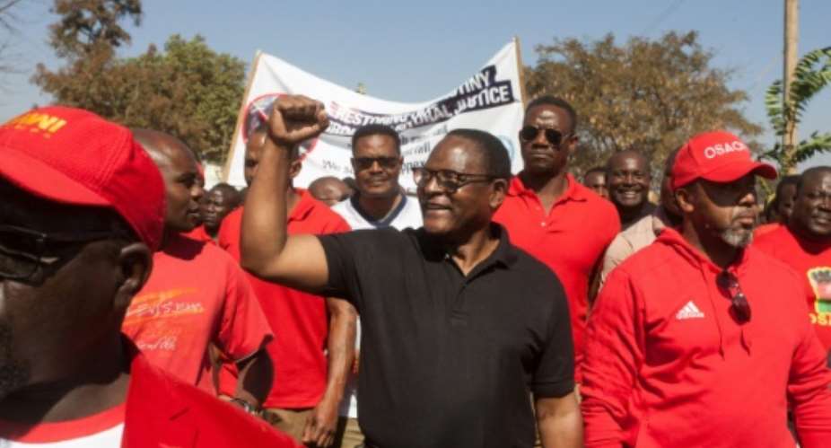 Lazarus Chakwera, seen here campaigning in June 2019, was elected president of Malawi after a rare do-over election.  By AMOS GUMULIRA AFPFile