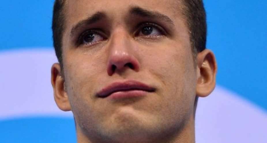 South Africas Chad le Clos poses on the podium.  By Fabrice Coffrini (AFP)
