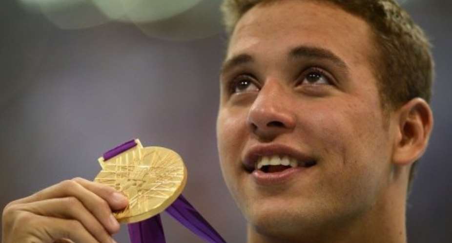 Le Clos won't be parted from his gold.  By Christophe Simon AFP