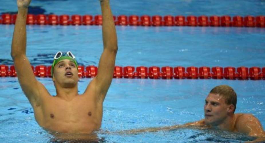 South Africas Chad Le Clos (L) celebrates winning the mens 200m butterfly final.  By Odd Andersen (AFP)