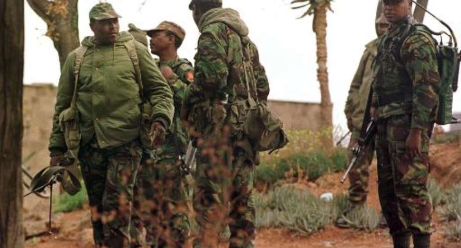 File photo shows members of the Lesotho military on patrol in the capital Maseru, on September 17, 1999.  By Walter Dhladhla AFPFile