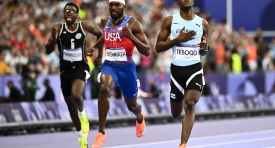 Letsile Tebogo crosses the line after winning the Olympic mens 200m with ease.  By Jewel SAMAD (AFP)