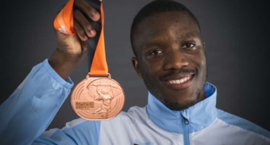 Letsile Tebogo from Botswana shows his 200 metres bronze medal after the 2023 world championships in Budapest..  By ANDREJ ISAKOVIC AFP