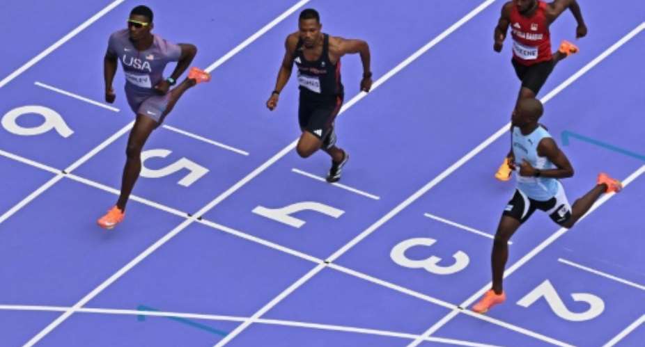Letsile Tebogo (R) is bidding to win an Olympic 100m-200m double though without his biggest fan present, his adored late mother.  By Antonin THUILLIER (AFP)
