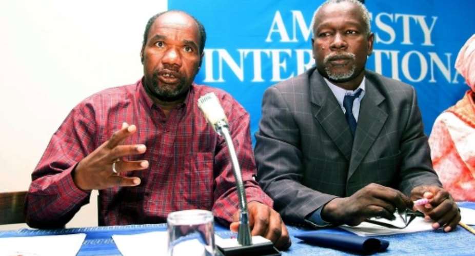 Liberated slave Jouma Ould Meissara (L) and Boubacar Ould Messaoud at a press conference.  By Seyllou (AFP/File)