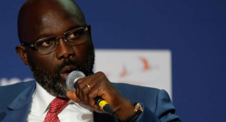 Liberia's new president, ex-football player George Weah, has lent the number from his national team jersey to a military hospital.  By FRANCOIS GUILLOT AFPFile