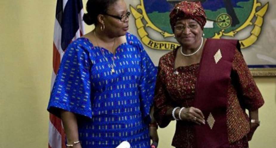 Liberian President Ellen Johnson Sirleaf R greets Liberian peace activist Leymah Gbowee at her office in Monrovia.  By Glenna Gordon AFPFile