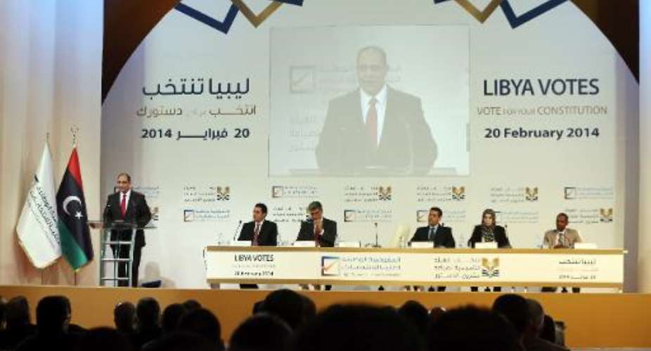 Libyan electoral commission chief Nuri al-Abbar (L) speaks during a press conference to announce the preliminary results of the election to choose a commission to draft a new constitution on March 1, 2014, in Tripoli.  By Mahmud Turkia (AFP)
