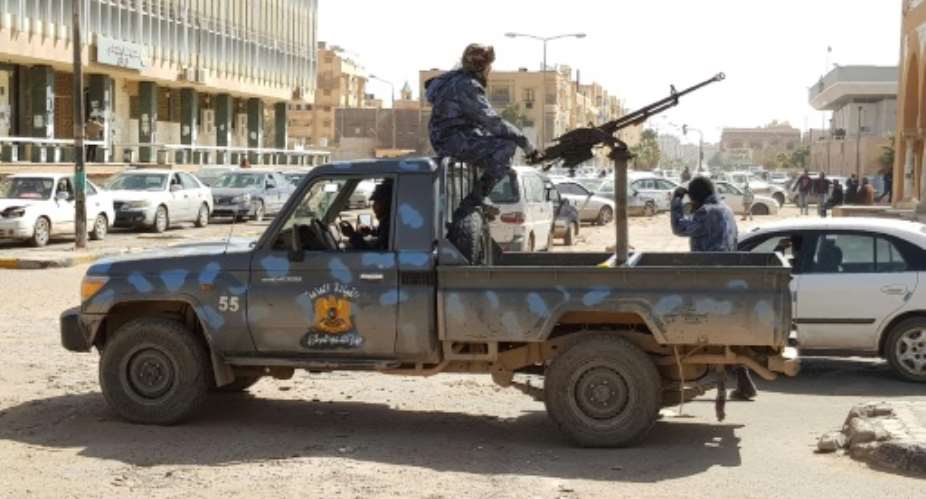 Libya has been torn between rival groups since dictator Moamer Kadhafi was overthrown in 2011 -- among them forces loyal to strongman Khalifa Haftar like these on patrol in the southern city of Sebha.  By - AFP