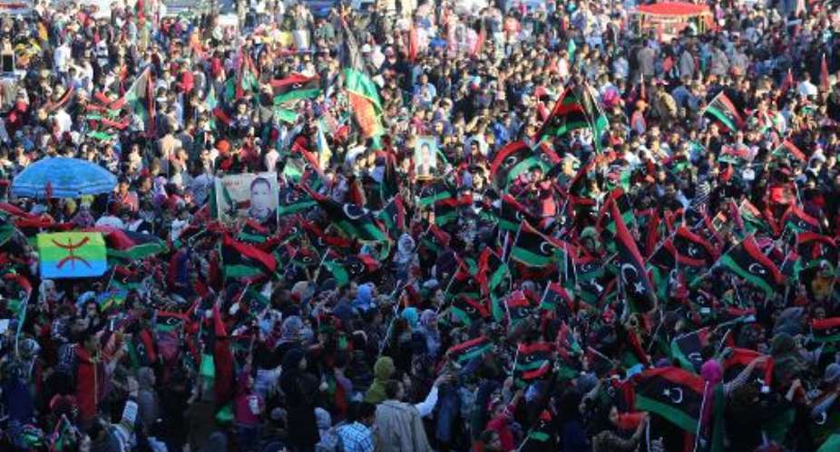 Libyans celebrate the third anniversary of the uprising at Martyrs square in the capital Tripoli, on February 17, 2014.  By Mahmud Turkia (AFP/File)