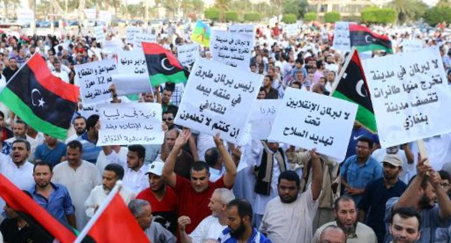 Libyans gather during a protest against the new nationalist-dominated parliament on August 8, 2014, in the capital Tripoli.  By Mahmud Turkia AFPFile