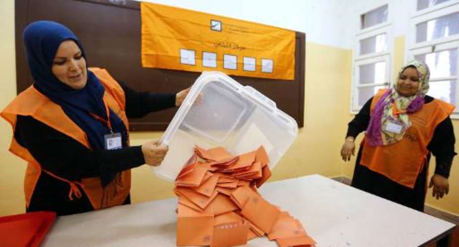 Libyan general election officials count ballots at a polling station in Tripoli's Tajura neighbourhood on June 25, 2014.  By Mahmud Turkia AFP