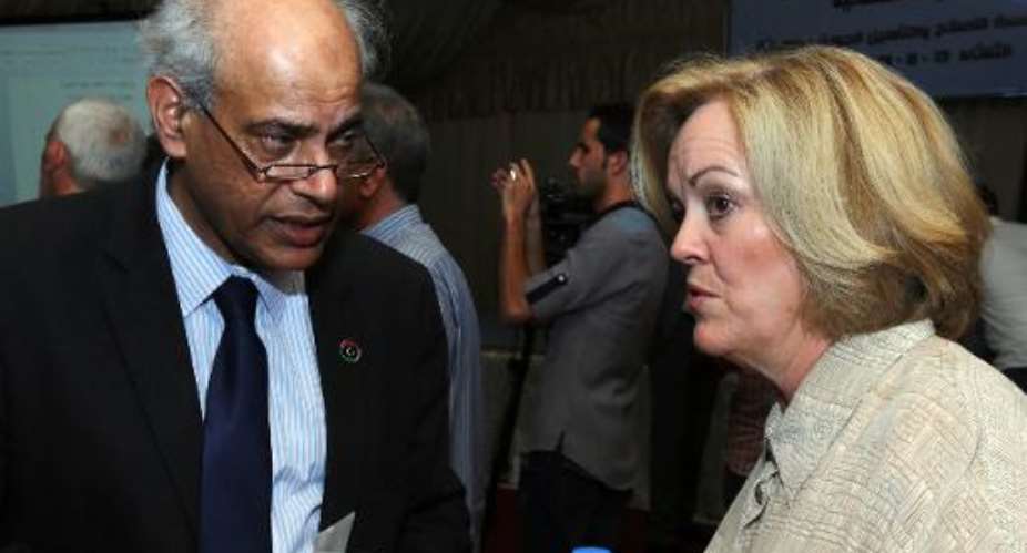 Salah al-Maghani and Deborah Jones at the opening ceremony in Misrata on August 13, 2013 of the Al-Gauia Reform and Rehabilitation center.  By Mahmud Turkia AFPFile