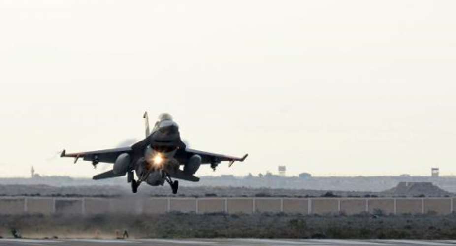 An Egyptian air force fighter jet lands at an undisclosed location in Egypt following air strikes in Libya, on February 16, 2015.  By - Egyptian MoDAFP