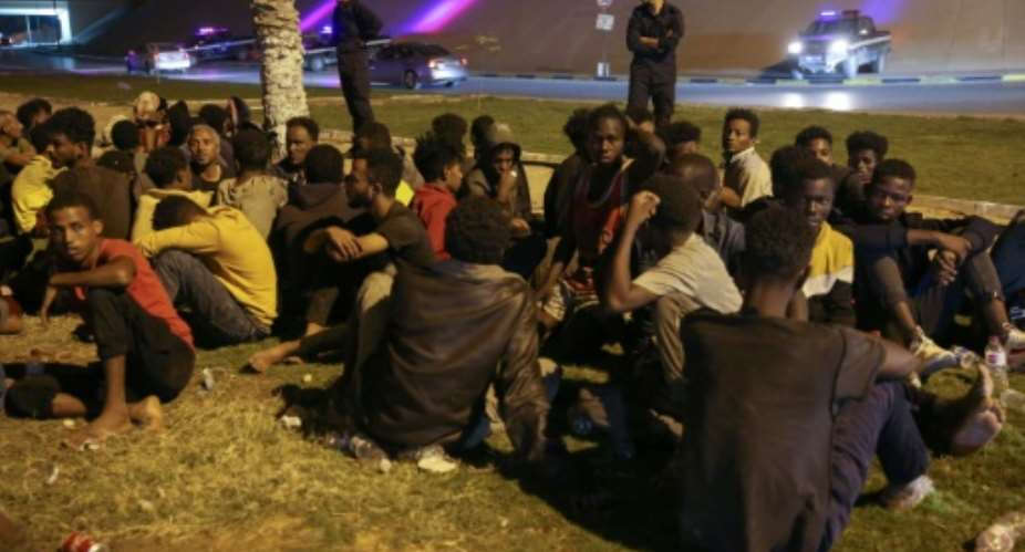 Libyan authorities round up migrants who attempted to join a mass breakout from an overcrowded Tripoli detention centre after guards shot dead six inmates.  By Hussam AHMED AFP
