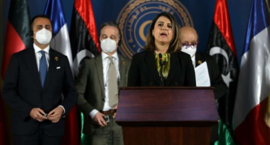 Libyan Foreign Minister Najla al-Mangoush speaks, as her counterparts R to L French Jean-Yves Le Drian, German Heiko Maas and Italian Luigi Di Maio listen, during a press conference in Libya's capital Tripoli, on March 25, 2021.  By Mahmud TURKIA AFP