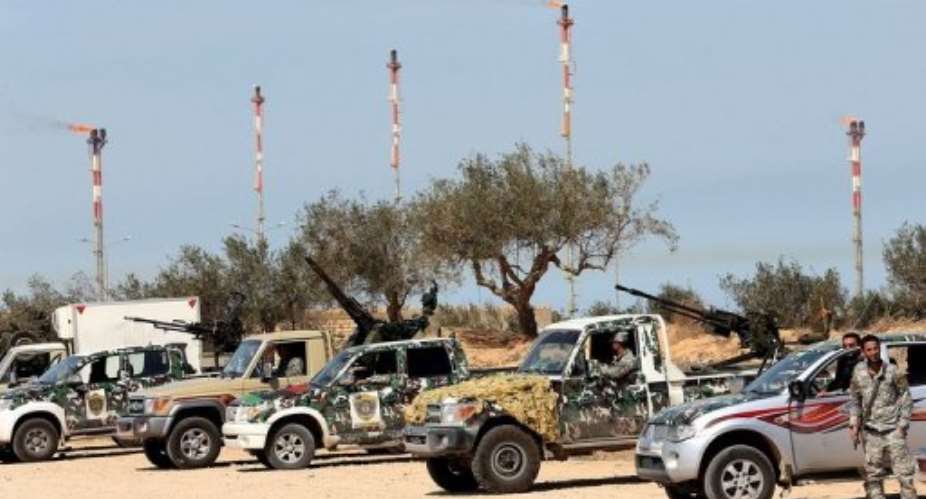 Libyan defence forces keep watch outside the Millitah Oil and Gas installation on March 4, 2013 in Zwara.  By Mahmud Turkia (AFP/File)