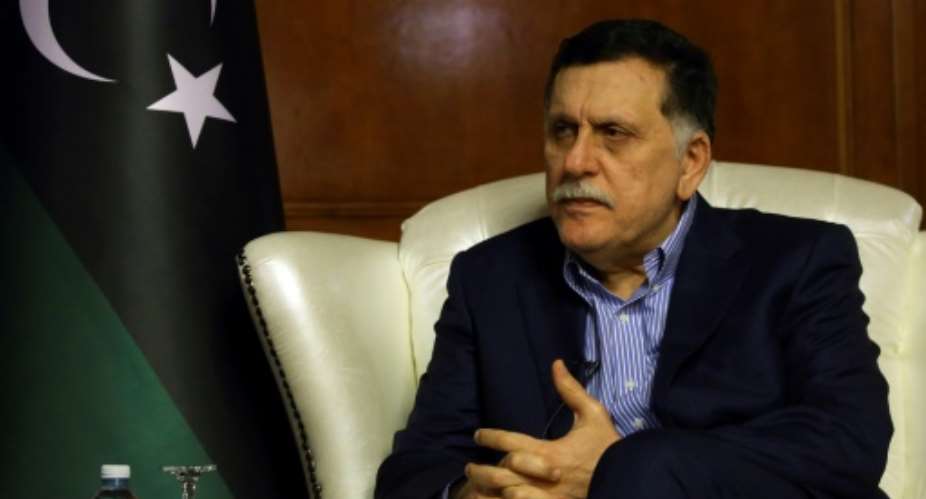 Libyan Prime Minister Fayez al-Sarraj speaks during an interview with AFP in Tripoli on November 8, 2018.  By Mahmud TURKIA AFP