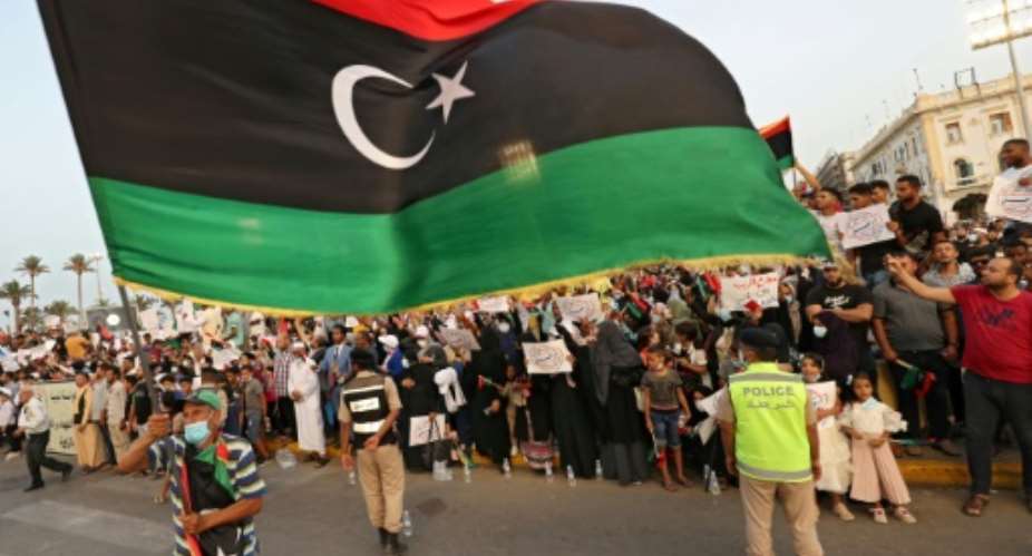 Libyans attend a rally in the capital Tripoli to denounce parliament's no-confidence vote against the unity government ahead of planned December elections.  By Mahmud TURKIA AFP