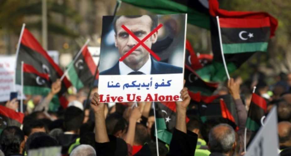 Libyans protested in Tripoli against France, accusing Paris of backing military strongman Khalifa Haftar.  By Mahmud TURKIA AFP