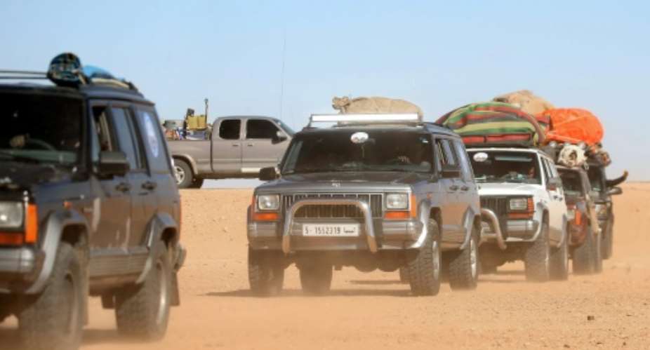 Libyans take part in a 4x4 tourism trip through the desert.  By Mahmud TURKIA AFP