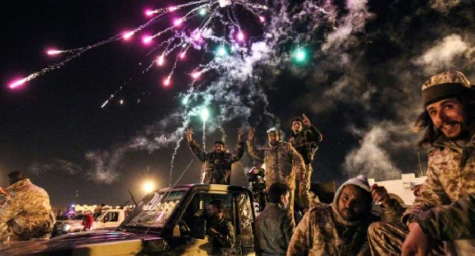 Libyans take part in a celebration with fireworks marking the sixth anniversary of the Libyan revolution, which toppled strongman Moamer Kadhafi, in Benghazi on February 17, 2017.  By Abdullah DOMA AFP