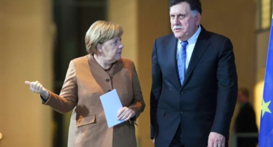 Libya's Prime Minister Fayez al-Sarraj and German Chancellor Angela Merkel discussed the migrant crisis during talks in Berlin.  By Maurizio Gambarini dpaAFP