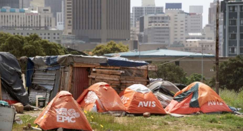 Life on the fringe: Tents housing homeless people on the edge of Cape Town.  By RODGER BOSCH AFP