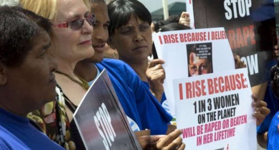 Western Cape Province Premier Helen Zille 2nd L joins a protest agaisnt rape on February 11, 2013.  By Rodger Bosch AFP