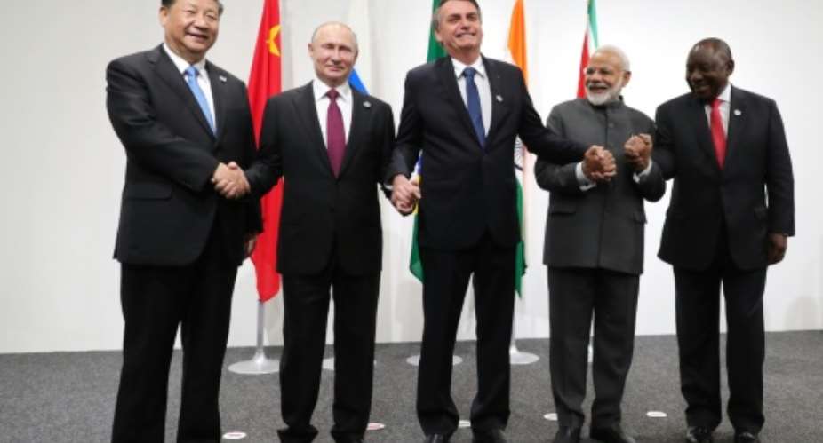Lineup at the BRICS summit in 2019: Chinese President Xi Jinping left; Russian President Vladimir Putin; Brazil's then president, Jair Bolsonaro; Indian Prime Minister Narendra Modi; and South African President Cyril Ramaphosa.  By Mikhail KLIMENTYEV AFP
