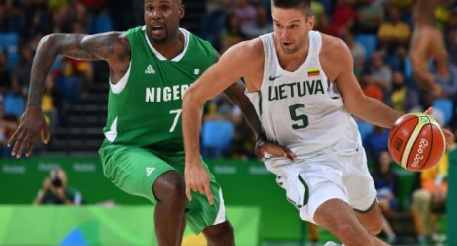 Lithuanias Mantas Kalnietis (R) tries to pass Nigerias Al-Farouq Aminu during their mens Group B basketball match, at the Rio 2016 Olympic Games, on August 9.  By Andrej Isakovic (AFP)