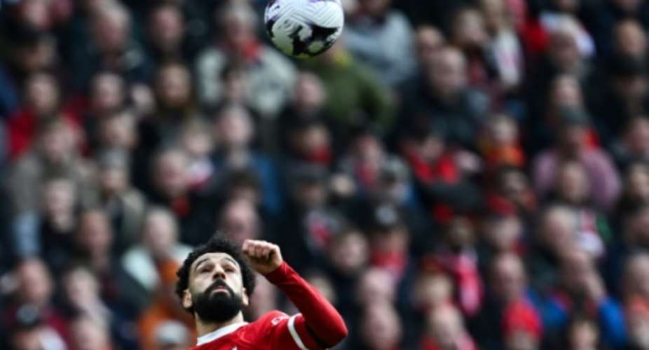 Liverpool star Mohamed Salah eyes the ball during a Premier League win over Brighton..  By Paul ELLIS AFP