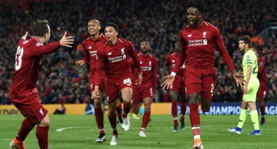 Liverpool's Divock Origi R celebrates after scoring against Barcelona.  By Paul ELLIS AFPFile