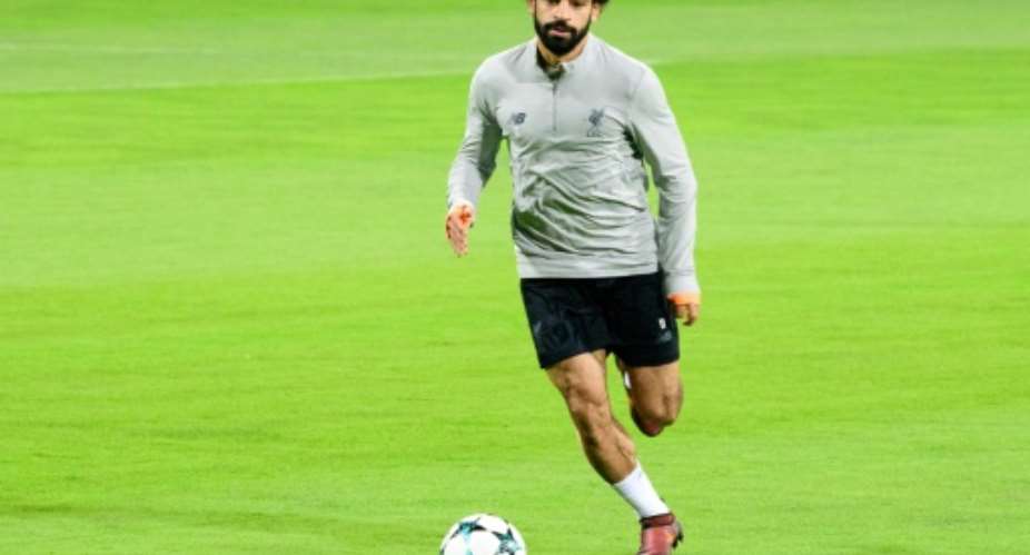 Liverpools Egyptian forward Mohamed Salah warms up during a training session on October 16, 2017.  By Jure Makovec AFP