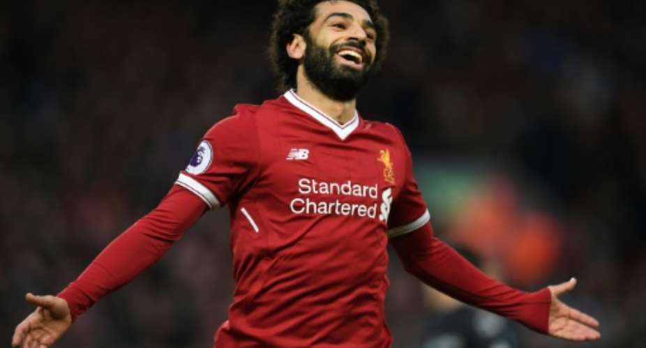 Liverpool's Egyptian midfielder Mohamed Salah celebrates scoring the team's first goal during the English Premier League football match against Leicester December 30, 2017.  By Paul ELLIS AFPFile