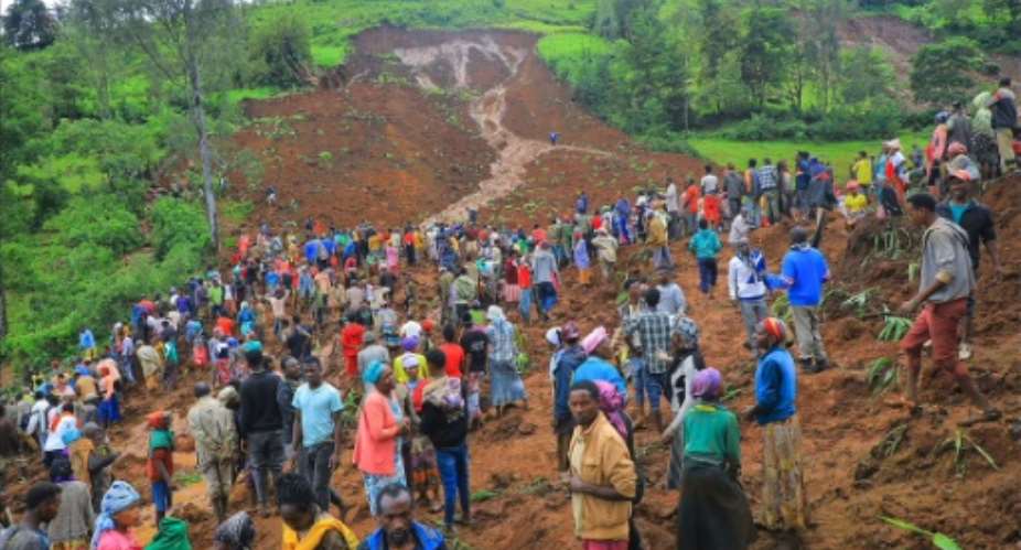 Local authorities showed crowds of locals at the site of the tragedy after the landslide in the isolated Geze-Gofa district of southern Ethiopia.  By - (Gofa Zone Government Communication Affairs Department/ESN/AFP)