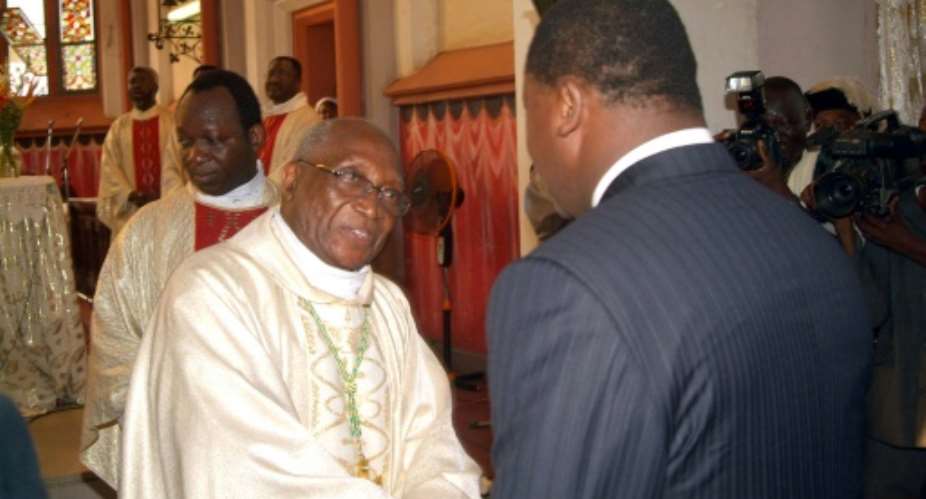 Lome's former archbishop Phillipe Kpodzro, seen here meeting Togo's President Faure Gnassingbe in 2006, has described the stubborn refusal to relinquish power as diabolical.  By Erick Christian Ahounou AFPFile