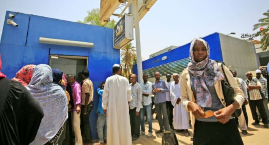 Long waits at the ATM for days and still no cash -- a chronic liquidity crisis is still gripping Sudan a month after its veteran strongman's ouster.  By ASHRAF SHAZLY AFP