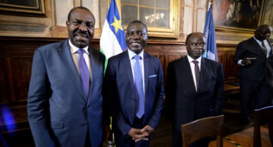 L-R: National Convergence Kwa Na Kwa party general secretary Bertin Bea, Republic of Central Africa foreign minister Charles Armel Doubaned and Central African president political advisor George Isidore Alphonse Dibert pose on June 19, 2017 in Rome.  By FILIPPO MONTEFORTE AFP
