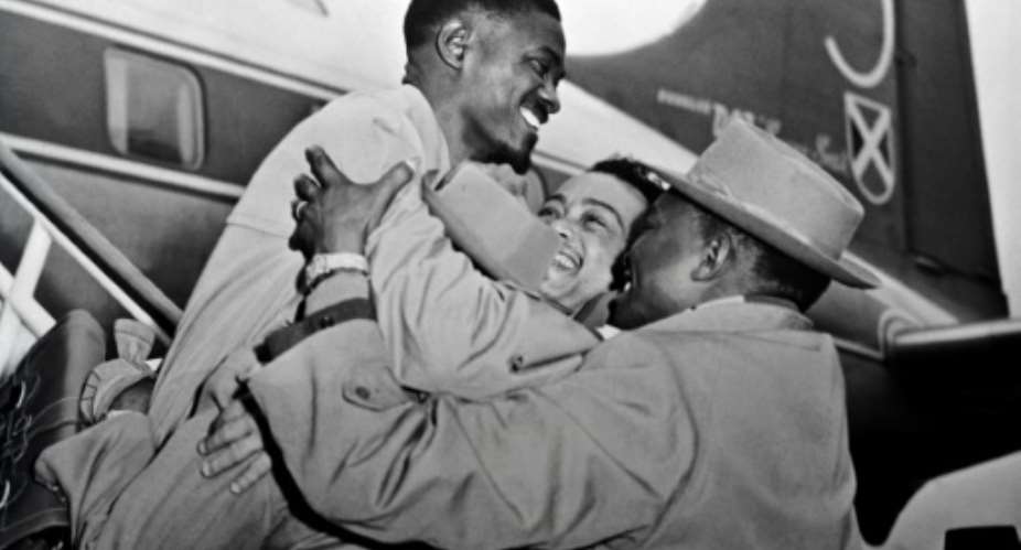 Lumumba, the hero of Belgian Congo's independence, is welcomed at Brussels airport in January 1960. Within a year, Lumumba would be dead..  By  AFP
